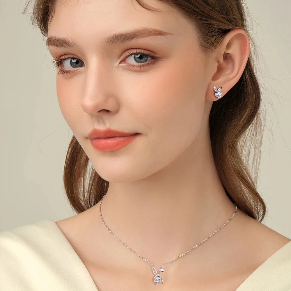 Moissanite earrings and pendant on model