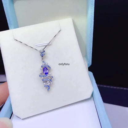 Side view showing tanzanite pendant and chain