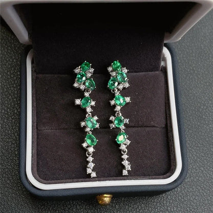 Emerald earrings in luxury packaging