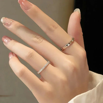 Eternity bands worn together on fingers