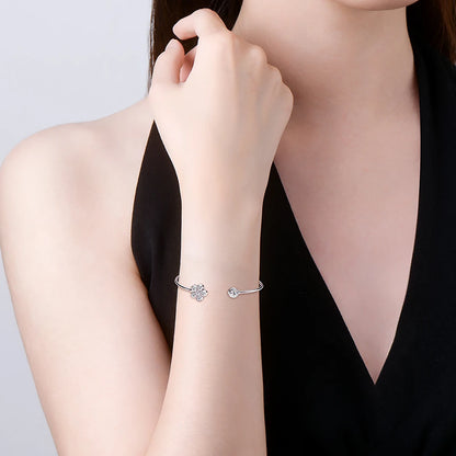 Woman wearing the GRA certified flower shape moissanite diamond bangle