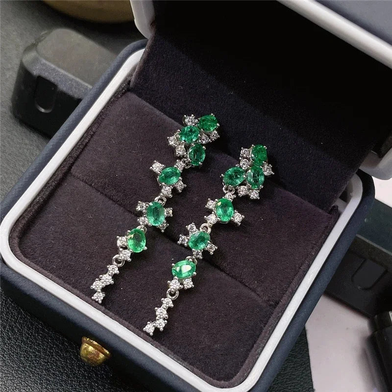 Emerald earrings in luxury packaging