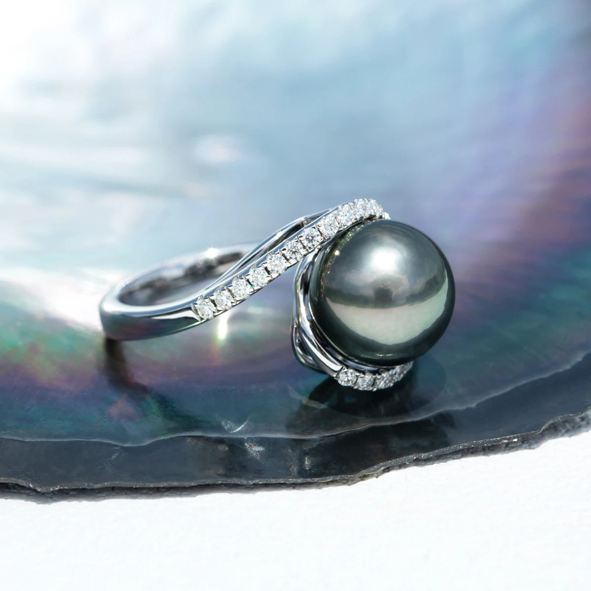 Moissanite Diamond accents sparkling around the pearl