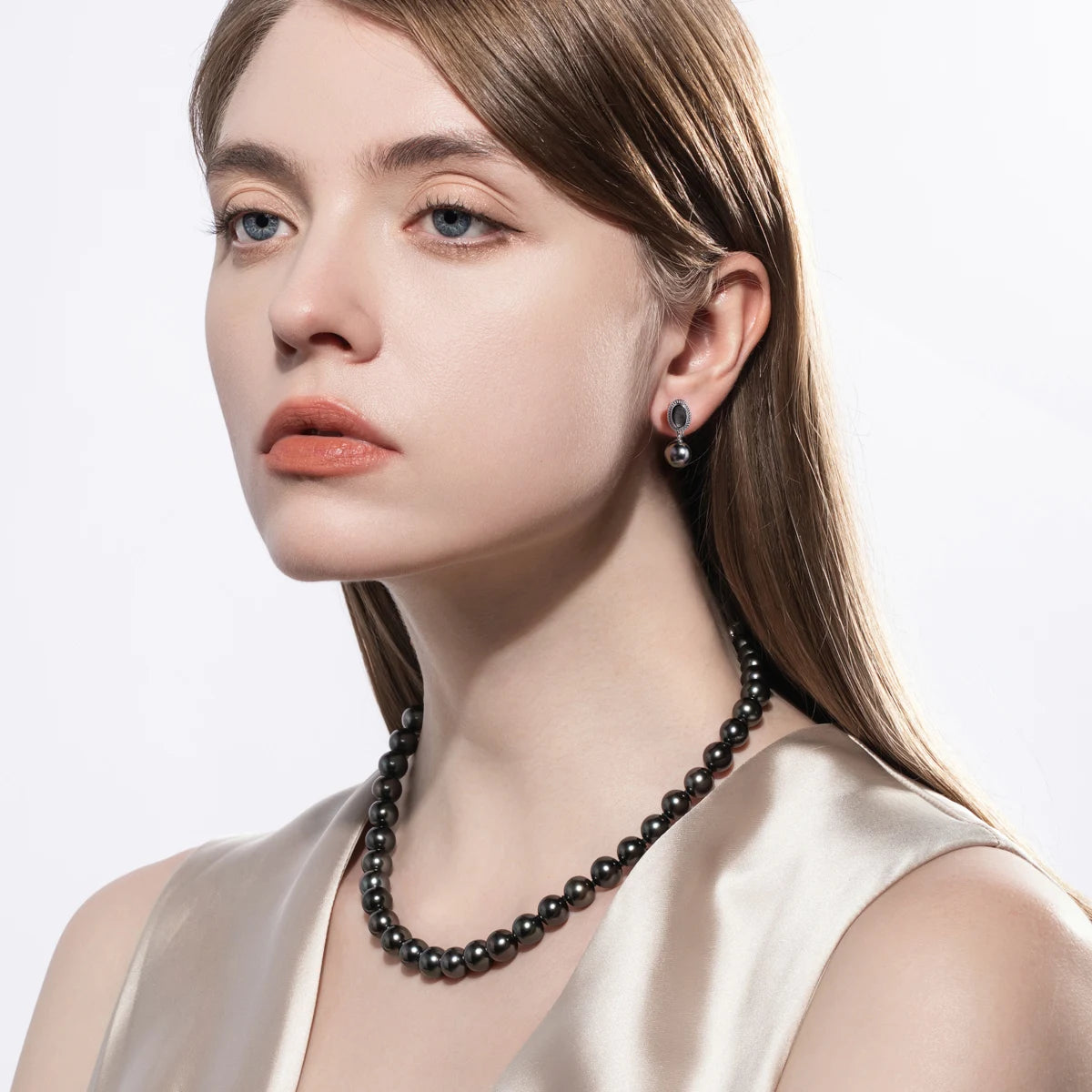 Woman wearing the AnuJewel 8-10mm Natural Tahitian Black Pearl Shell Earrings