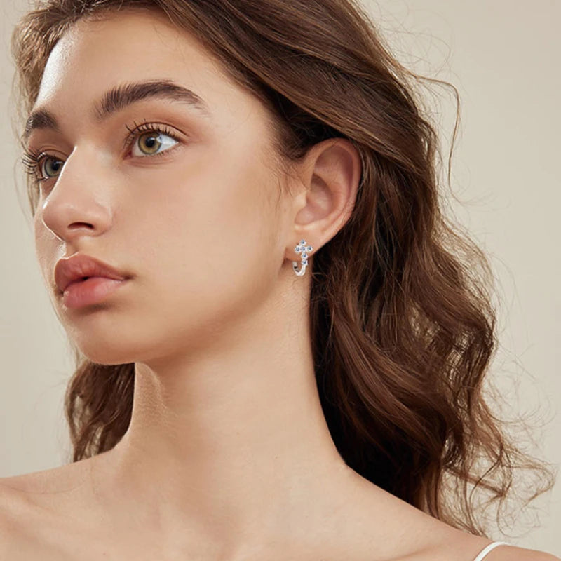 Model wearing the light luxury cross earrings for daily wear